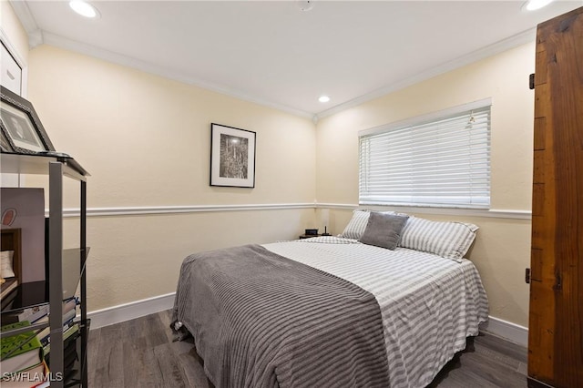 bedroom with dark wood-type flooring and ornamental molding