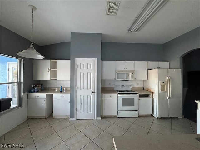 kitchen with white appliances, tasteful backsplash, white cabinets, light tile patterned flooring, and decorative light fixtures