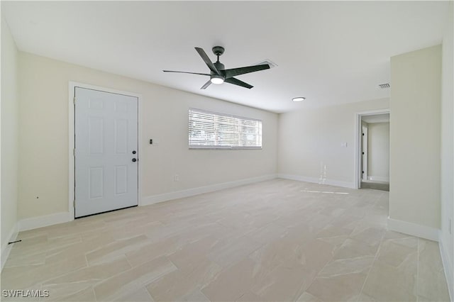 spare room with ceiling fan