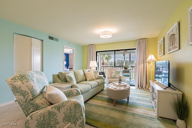 living room with light tile patterned flooring