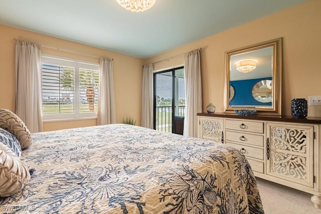 bedroom featuring carpet and access to outside