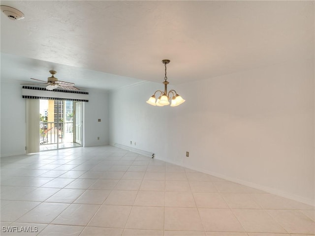 unfurnished room featuring light tile patterned floors and ceiling fan with notable chandelier