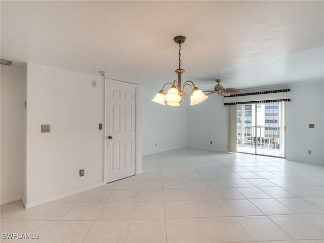 tiled empty room featuring ceiling fan with notable chandelier