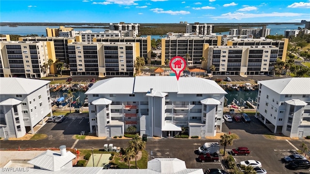 birds eye view of property with a water view