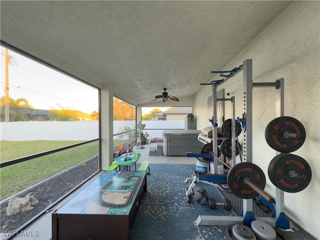 sunroom with ceiling fan