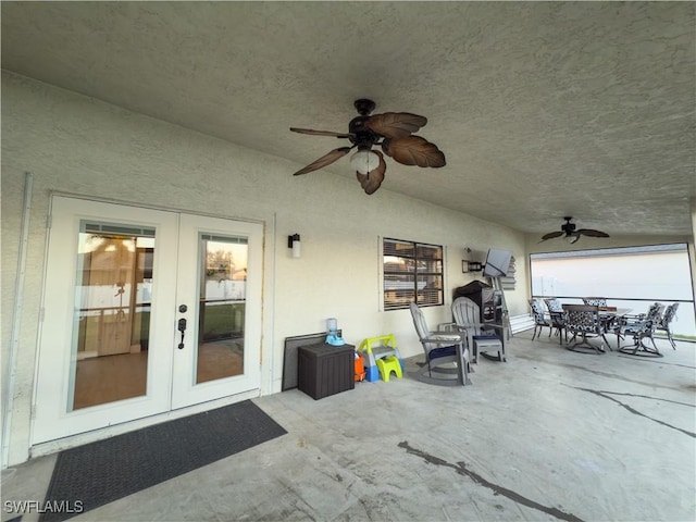 view of patio featuring ceiling fan and french doors