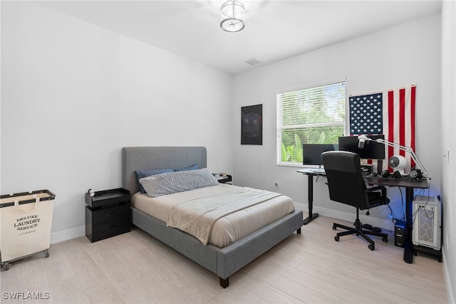 bedroom featuring light hardwood / wood-style floors