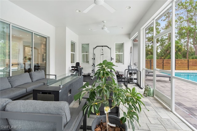 sunroom with ceiling fan