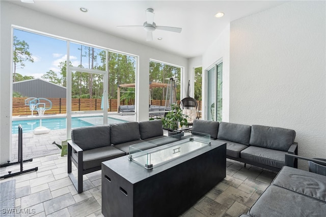 interior space with ceiling fan