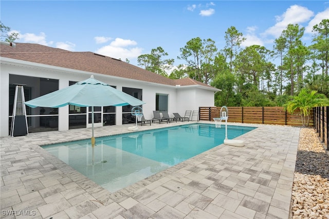 view of swimming pool featuring a patio area