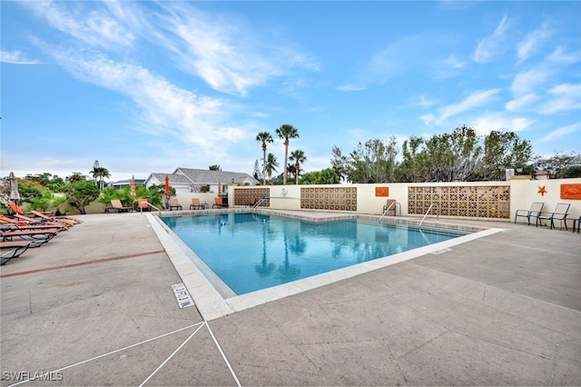 view of swimming pool with a patio area