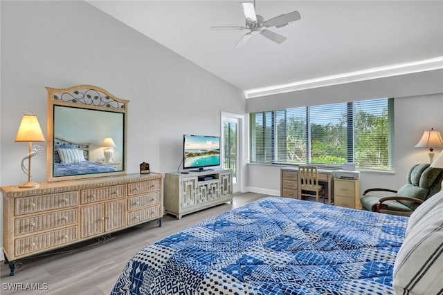 bedroom with ceiling fan, vaulted ceiling, and hardwood / wood-style flooring