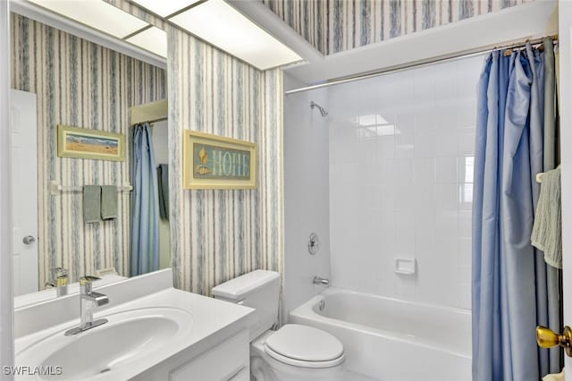 full bathroom with shower / bath combination with curtain, vanity, and toilet