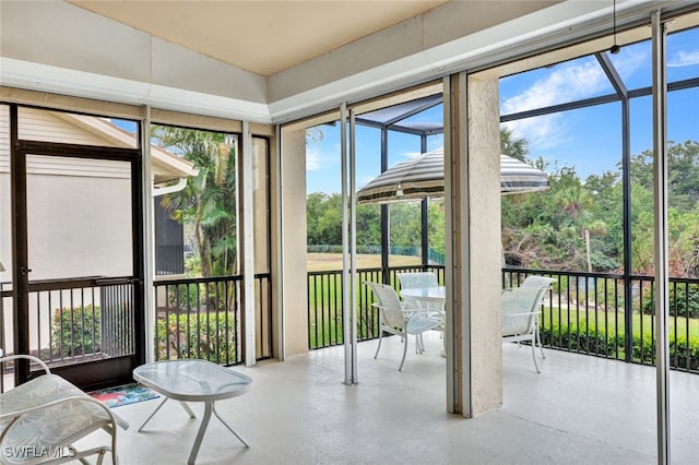 unfurnished sunroom featuring a healthy amount of sunlight