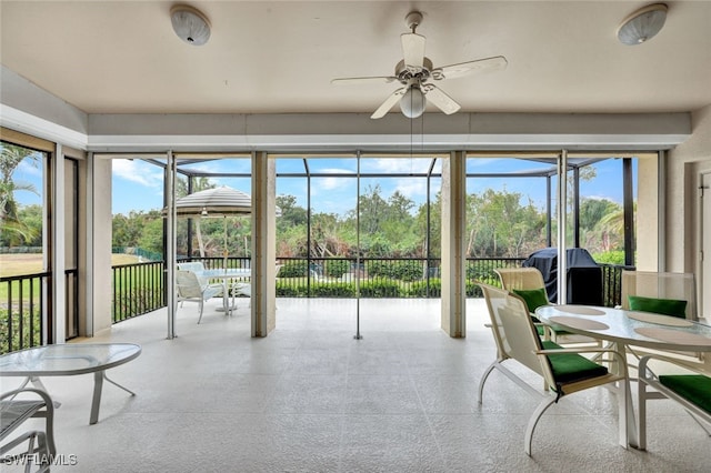 sunroom / solarium with ceiling fan