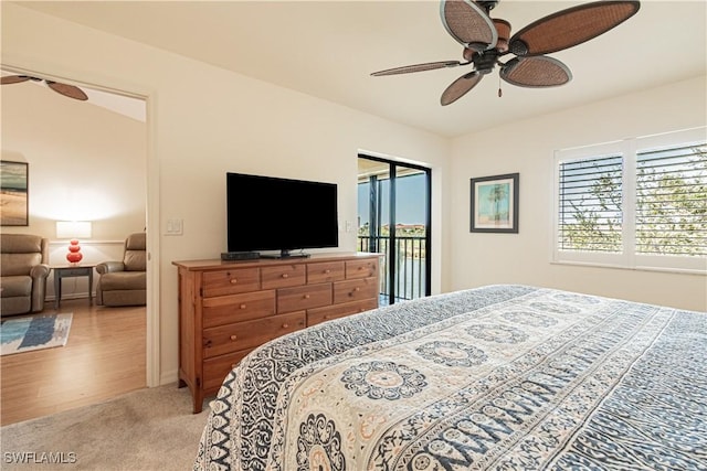 carpeted bedroom with ceiling fan and access to outside