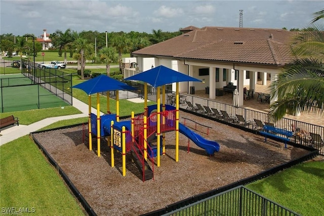 view of play area featuring a lawn