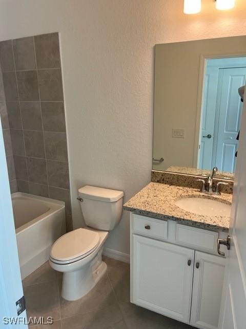 bathroom with tile patterned floors, vanity, and toilet