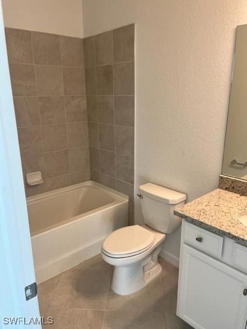 full bathroom with toilet, vanity, tile patterned floors, and shower / washtub combination