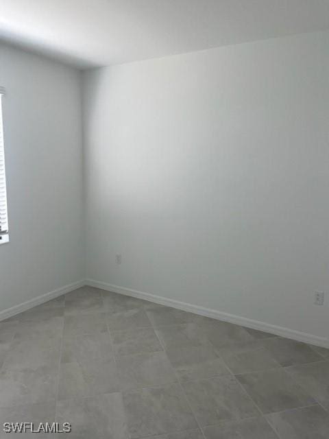 empty room featuring tile patterned flooring