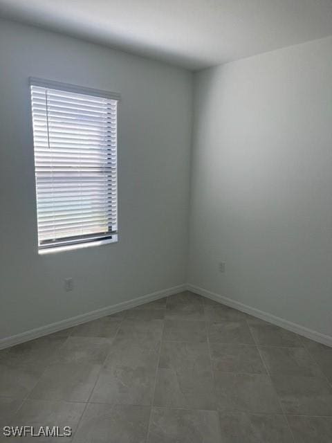 empty room featuring tile patterned flooring