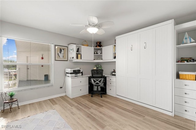 home office featuring light hardwood / wood-style floors and ceiling fan