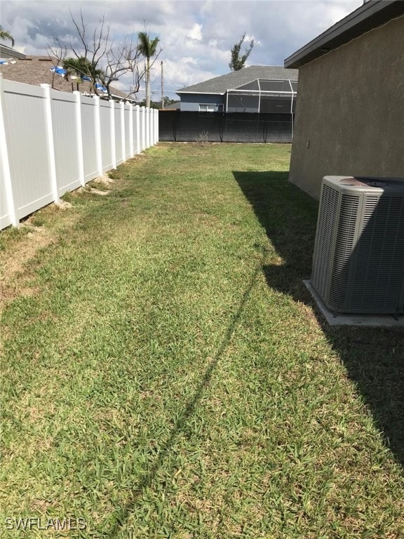 view of yard featuring central AC unit