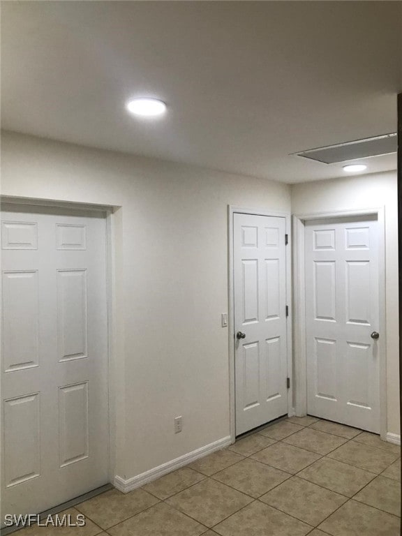 interior space with light tile patterned floors