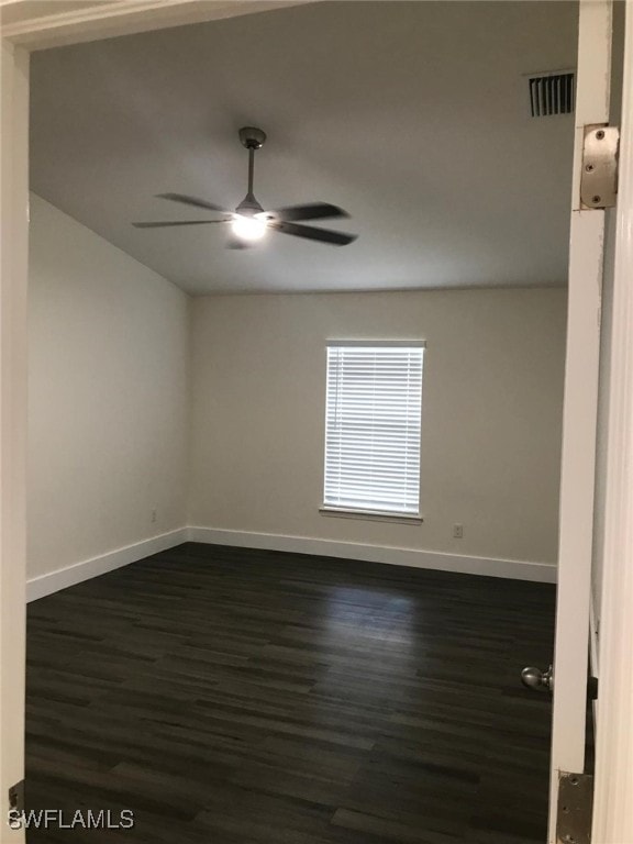 unfurnished room featuring dark hardwood / wood-style flooring and ceiling fan