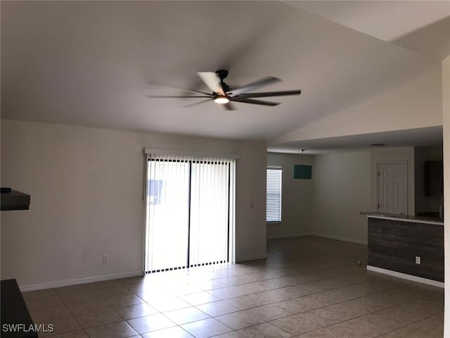 unfurnished living room featuring ceiling fan, lofted ceiling, and light tile patterned flooring