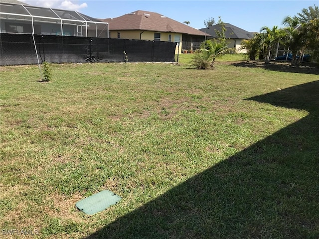 view of yard with a lanai