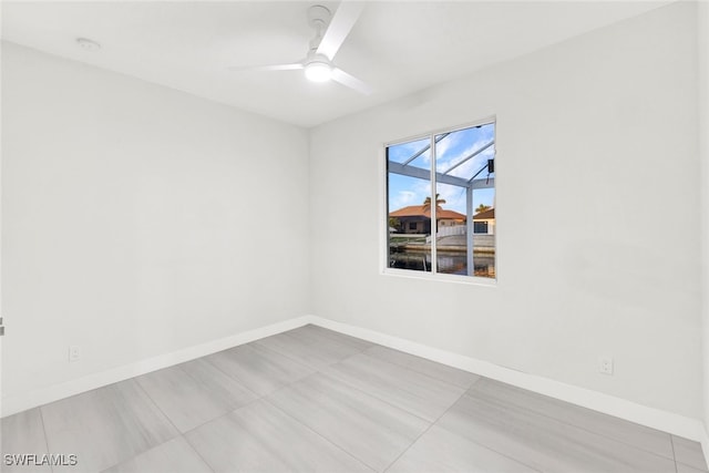 unfurnished room featuring ceiling fan