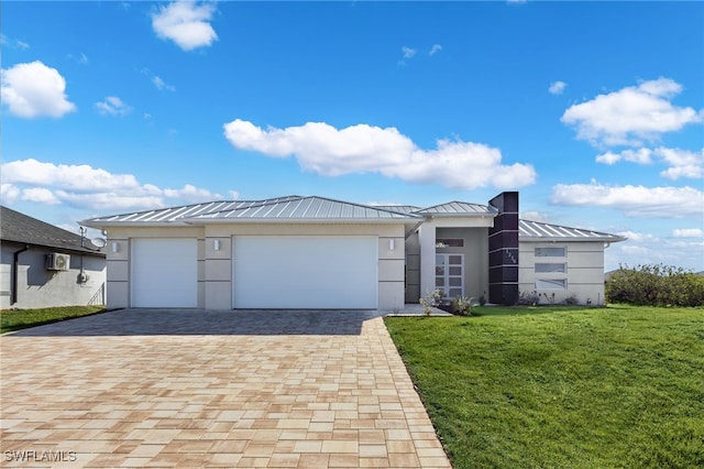 view of front of home with a standing seam roof, decorative driveway, and metal roof