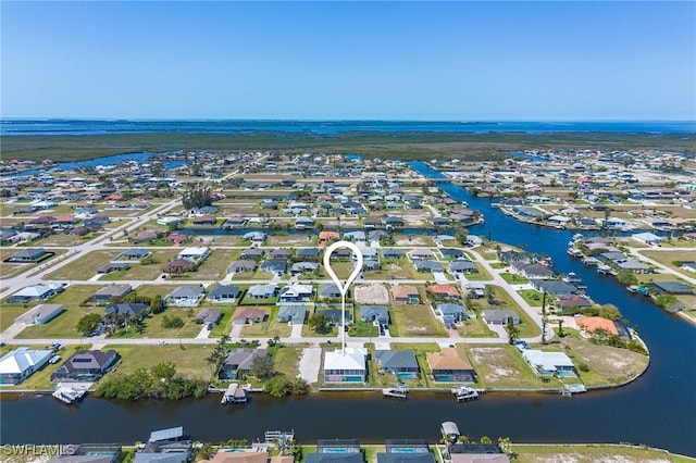 bird's eye view with a water view and a residential view