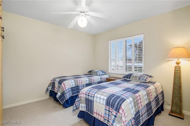 bedroom featuring light carpet and ceiling fan