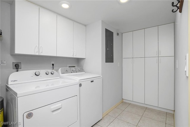 laundry room featuring cabinets, light tile patterned flooring, separate washer and dryer, and electric panel