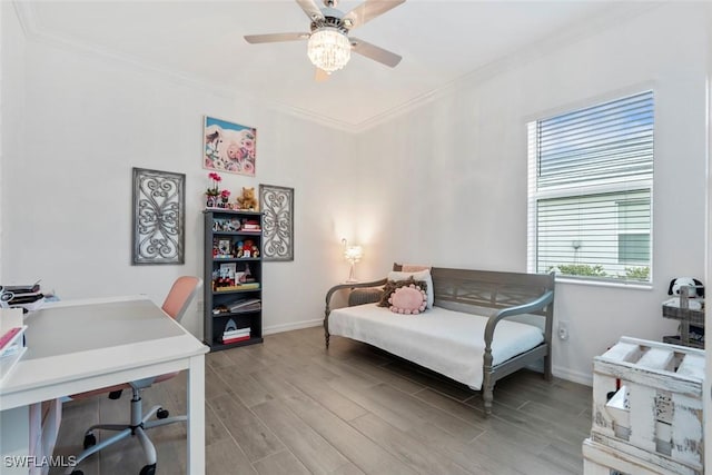 bedroom featuring hardwood / wood-style flooring, ceiling fan, ornamental molding, and multiple windows