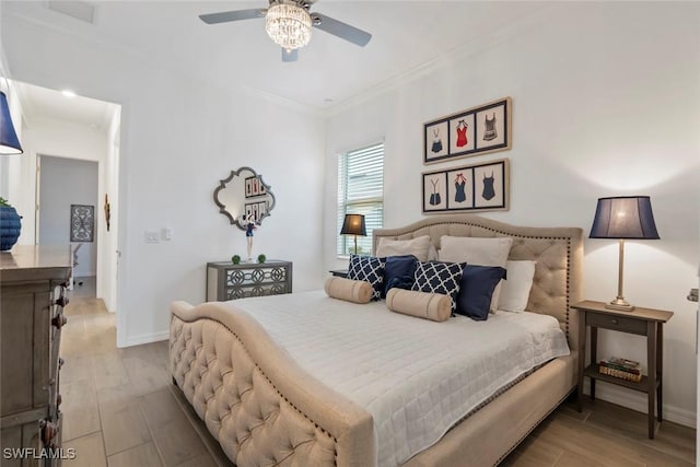 bedroom featuring light wood-type flooring, ceiling fan, and ornamental molding