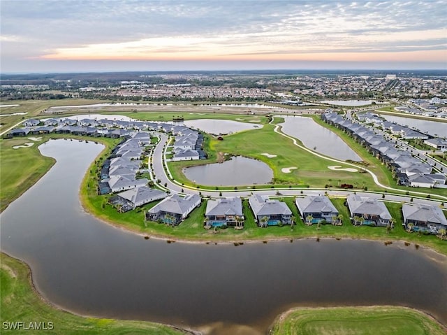 aerial view at dusk with a water view