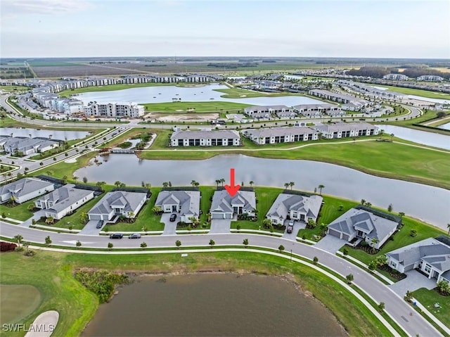 birds eye view of property featuring a water view