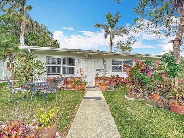 view of front of home with a front yard