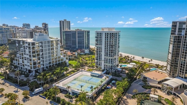 birds eye view of property featuring a city view and a water view