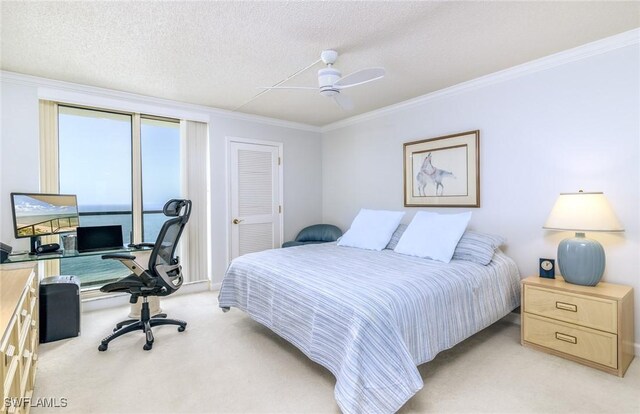 bedroom with a textured ceiling, crown molding, ceiling fan, and light carpet