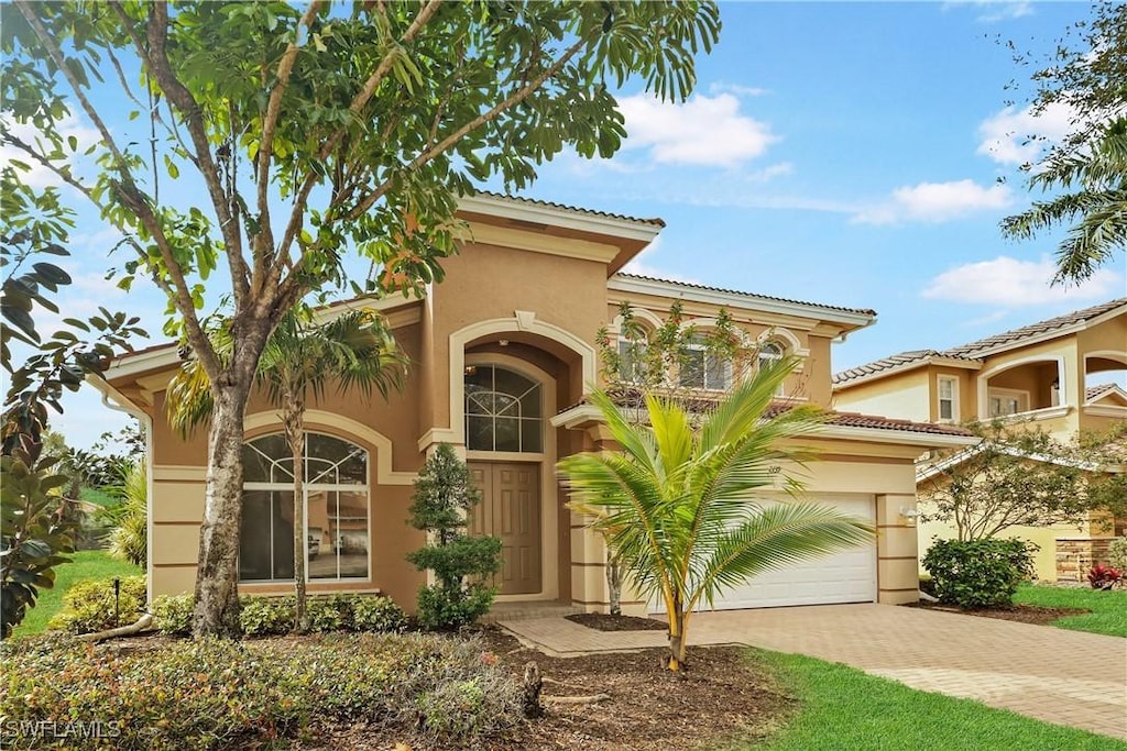 mediterranean / spanish house featuring a garage