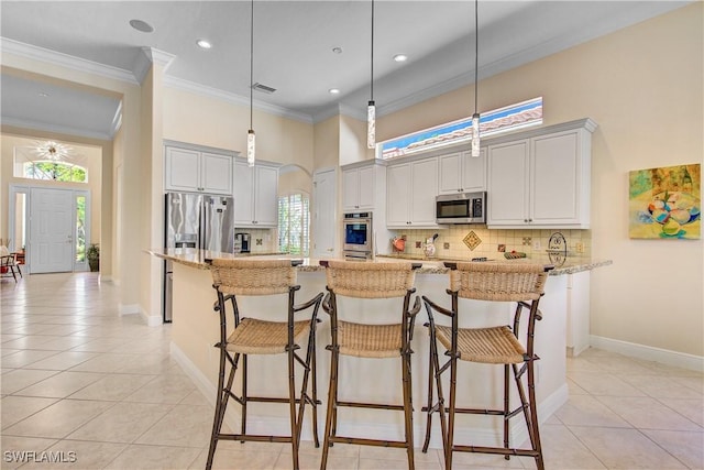 kitchen with decorative backsplash, light stone counters, light tile patterned flooring, and stainless steel appliances