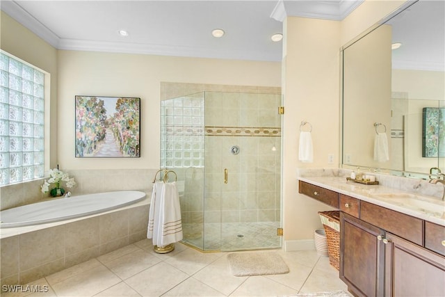 bathroom featuring tile patterned flooring, vanity, ornamental molding, and independent shower and bath