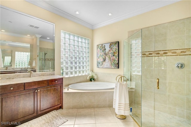 bathroom with tile patterned floors, crown molding, vanity, and plus walk in shower