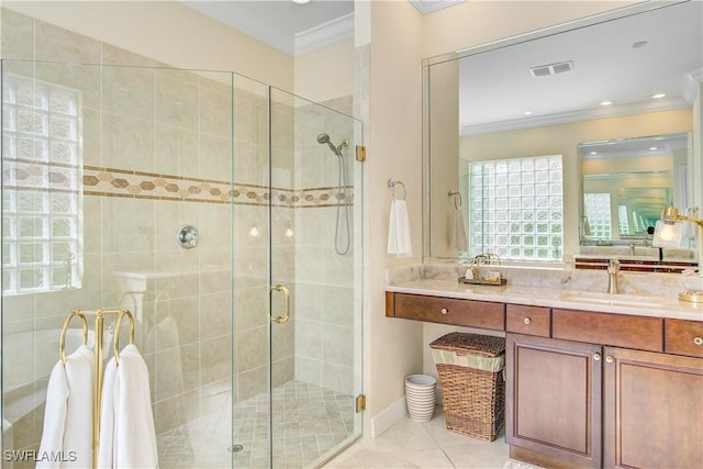 bathroom with tile patterned flooring, vanity, an enclosed shower, and ornamental molding