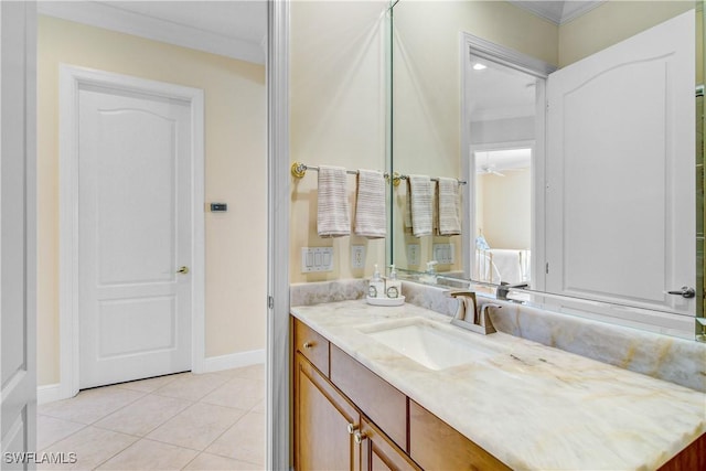 bathroom with tile patterned flooring, vanity, ceiling fan, and crown molding