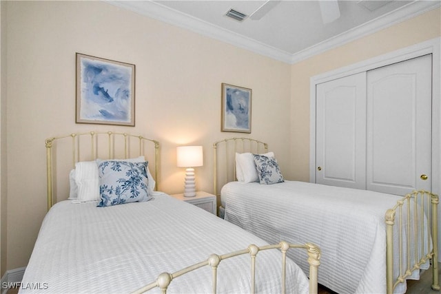 bedroom with a closet, ceiling fan, and crown molding